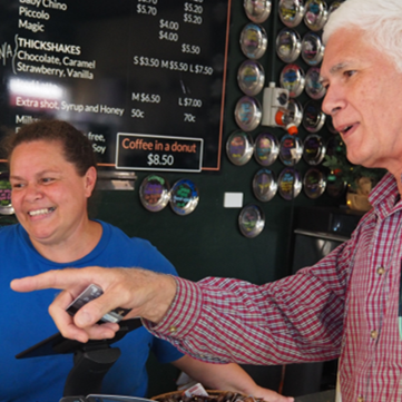 Wayne Parcell talking to a business owner